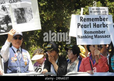 Protesters from Korean community are seen in a demonstration against visiting Japanese Prime Minister Shinzo Abe in Stanford University, California, the United States, on April 30, 2015. Over one hundred Chinese and Korean Americans gathered outside Stanford Unviersity s Bing Concert Hall and urged visiting Japanese Prime Minister Shinzo Abe to stop distorting history when he arrived there for a speech on campus. )(azp) US-CALIFORNIA-STANDFORD-JAPAN PM-SPPECH xuxyong PUBLICATIONxNOTxINxCHN   protesters from Korean Community are Lakes in a Demonstration against Visiting Japanese Prime Ministers Stock Photo