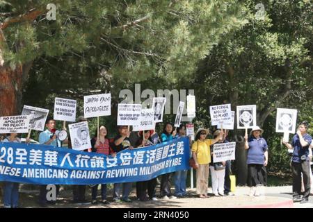 Protesters from Chinese community are seen in a demonstration against visiting Japanese Prime Minister Shinzo Abe in Stanford University, California, the United States, on April 30, 2015. Over one hundred Chinese and Korean Americans gathered outside Stanford Unviersity s Bing Concert Hall and urged visiting Japanese Prime Minister Shinzo Abe to stop distorting history when he arrived there for a speech on campus. )(azp) US-CALIFORNIA-STANDFORD-JAPAN PM-SPPECH xuxyong PUBLICATIONxNOTxINxCHN   protesters from Chinese Community are Lakes in a Demonstration against Visiting Japanese Prime Ministe Stock Photo