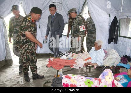 (150507) -- KATHMANDU, May 7, 2015 -- Nepalese Chief of the Army Staff Gaurav SJB Rana (2nd L) talks to an injured man during a visit to the Chinese military medical camp at the Singha Durbar Army Barrack in Kathmandu, Nepal, May 7, 2015. During a visit of the Chinese military medical camp in Kathmandu with the Chinese Ambassador to Nepal Wu Chuntai on Thursday, Nepalese Chief of the Army Staff Gaurav SJB Rana appreciated the effective and flexible assistance of Chinese team who has been working in search and rescue, as well as medical and anti-epidemic efforts. ) NEPAL-KATHMANDU-CHINA-MILITAR