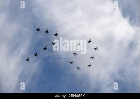 (150509) -- MOSCOW, May 9, 2015 -- Sukhoi Su-27 and Mikoyan MiG-29 of the Russian Knights and Strizhi aerobatic teams fly over the Red Square during the military parade marking the 70th anniversary of the victory in the Great Patriotic War, in Moscow, Russia, May 9, 2015. ) RUSSIA-MOSCOW-VICTORY DAY PARADE JiaxYuchen PUBLICATIONxNOTxINxCHN   Moscow May 9 2015 Sukhoi SU 27 and Mikoyan Mig 29 of The Russian Knights and Strizhi Aerobatic Teams Fly Over The Red Square during The Military Parade marking The 70th Anniversary of The Victory in The Great Patriotic was in Moscow Russia May 9 2015 Russi Stock Photo