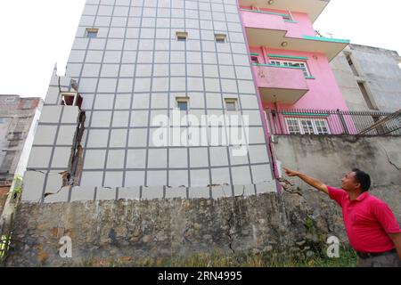 (150513) -- KATHMANDU, May 13, 2015 -- A man shows the cracks on his damaged building at Samakhusi in Kathmandu, Nepal, May 13, 2015. The death toll in a fresh powerful quake that hit Nepal on Tuesday has reached 65 and more than 1,900 others were injured, the Ministry of Home Affairs said on Wednesday. )(azp) NEPAL-KATHMANDU-EARTHQUAKE-AFTERMATH SunilxSharma PUBLICATIONxNOTxINxCHN   150513 Kathmandu May 13 2015 a Man Shows The Cracks ON His damaged Building AT  in Kathmandu Nepal May 13 2015 The Death toll in a Fresh Powerful Quake Thatcher Hit Nepal ON Tuesday has reached 65 and More than 1 Stock Photo