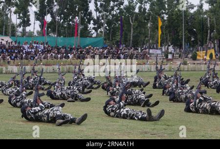 (150514) -- SRINAGAR, May 14, 2015 -- Recruits of India s Central Reserve Police Force (CRPF) show their skills during a passing-out parade at a training center on the outskirts of Srinagar, the summer capital of Indian-controlled Kashmir, May 14, 2015. A total of 341 recruits were formally inducted into the India s CRPF after completing nine months of rigorous training in physical fitness, weapon handling, commando operations and counter insurgency, a CRPF spokesman said. ) (azp) KASHMIR-SRINAGAR-PASSING-OUT PARADE JavedxDar PUBLICATIONxNOTxINxCHN   150514 Srinagar May 14 2015 recruits of Ind Stock Photo