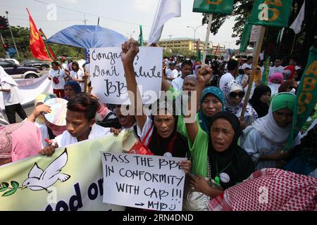 (150518) -- QUEZON CITY, May 18, 2015 -- Muslim people attend a peace rally in Quezon City, the Philippines, May 18, 2015. The Muslim people are calling for the passage of the Bangsamoro Basic Law (BBL) that would create a Bangsamoro sub-state with sovereign powers to be governed exclusively by Filipino Muslims in southern Philippines. ) THE PHILIPPINES-QUEZON CITY-MUSLIM PEACE RALLY RouellexUmali PUBLICATIONxNOTxINxCHN   Quezon City May 18 2015 Muslim Celebrities attend a Peace Rally in Quezon City The Philippines May 18 2015 The Muslim Celebrities are Calling for The Passage of The Bangsamor Stock Photo