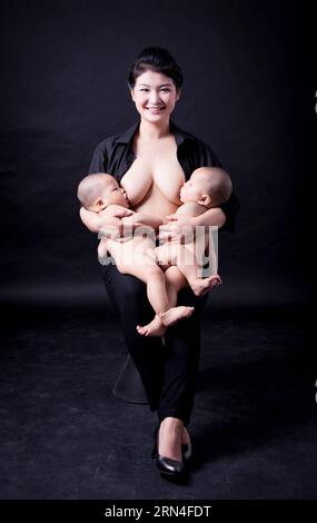 (150520) -- BEIJING, May 20, 2015 -- Photo provided by La Leche League-China shows a mother breastfeeding children. May 20 is China s National Breastfeeding Awareness Day. As the pronounciation of 520 is close to I Love You, many mothers feel meaningful to have their breastfeeding photos to make public. La Leche League-China, a branch of an international organization that provides mother-to-mother support, information and encouragment for breastfeeding, has collected art photos of breastfeeding mothers for three consecutive years. () (lfj) CHINA-BREASTFEEDING DAY-ART PHOTOS (CN) Xinhua/LaxLech Stock Photo