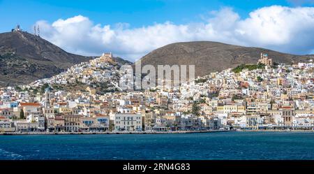 View of the town of Ermoupoli, on the hill the Basilica of San Giorgio in Ano Syros, and Anastasi Church or Church of the Resurrection, Syros Stock Photo