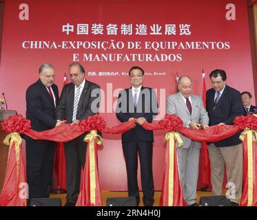 (150520) -- RIO DE JANEIRO, May 20, 2015 -- Chinese Premier Li Keqiang (C), Brazilian Foreign Minister Mauro Vieira (2nd R) and Rio de Janeiro Governor Luiz Fernando Pezao (2nd L) cut ribbon for a Chinese equipment manufacturing exhibition in Rio De Janeiro, Brazil, May 20, 2015. Li on Wednesday visited the exhibition which features heavy machinery, high-speed railway, nuclear power generation, carrier rockets and new energy cars in Rio De Janeiro. ) (wf) BRAZIL-RIO DE JANEIRO-CHINESE PREMIER-VISIT DingxLin PUBLICATIONxNOTxINxCHN   150520 Rio de Janeiro May 20 2015 Chinese Premier left Keqiang Stock Photo