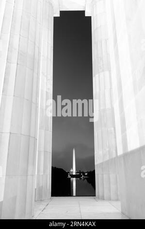 WASHINGTON, DC - The Washington Momument viewed through columns at the Lincoln Memorial. Towering 554 feet above the National Mall in Washington DC, t Stock Photo