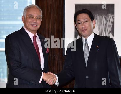 (150525) -- TOKYO, May 25, 2015 () -- Japanese Foreign Minister Fumio Kishida (R) shakes hands with visiting Malaysian Prime Minister Najib Razak during their meeting in Tokyo, capital of Japan, on May 25, 2015. () JAPAN-TOKYO-MALAYSIA-PM-VISIT Xinhua PUBLICATIONxNOTxINxCHN   150525 Tokyo May 25 2015 Japanese Foreign Ministers Fumio Kishida r Shakes Hands With Visiting Malaysian Prime Ministers Najib Razak during their Meeting in Tokyo Capital of Japan ON May 25 2015 Japan Tokyo Malaysia PM Visit XINHUA PUBLICATIONxNOTxINxCHN Stock Photo