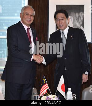 (150525) -- TOKYO, May 25, 2015 () -- Japanese Foreign Minister Fumio Kishida (R) shakes hands with visiting Malaysian Prime Minister Najib Razak during their meeting in Tokyo, capital of Japan, on May 25, 2015. () JAPAN-TOKYO-MALAYSIA-PM-VISIT Xinhua PUBLICATIONxNOTxINxCHN   150525 Tokyo May 25 2015 Japanese Foreign Ministers Fumio Kishida r Shakes Hands With Visiting Malaysian Prime Ministers Najib Razak during their Meeting in Tokyo Capital of Japan ON May 25 2015 Japan Tokyo Malaysia PM Visit XINHUA PUBLICATIONxNOTxINxCHN Stock Photo