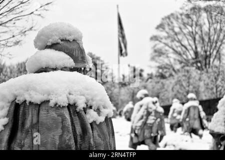 WASHINGTON, DC - Freshly fallen snow on the solder sculptures at the Korean War Veterans Memorial in Washington DC. The Korean War Memorial on the Nat Stock Photo