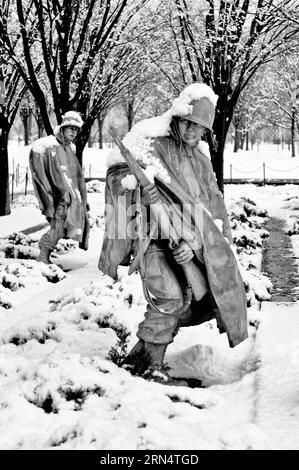 WASHINGTON, DC - Freshly fallen snow on the solder sculptures at the Korean War Veterans Memorial in Washington DC. The Korean War Memorial on the Nat Stock Photo