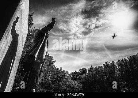 ARLINGTON, Virginia — The Theodore Roosevelt Memorial stands as a serene island amidst the Potomac River. The wooded 88-acre site, accessed by a footbridge, features a statue of the 26th president, surrounded by granite tablets inscribed with his notable quotations. Stock Photo