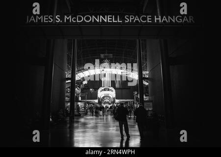 The entrance to the James S. McDonnell Space Hangar, with the Space Shuttle Discovery seen through the corridor. The decommissioned Discovery is on permanent display in the James S. McDonnell Space Hangar at the Smithsonian's National Air and Space Museum's Udvar-Hazy Center in Chantilly, Virginia, just outside Washington DC. The shuttle arrived at the museum on April 19, 2012, and replaces the Space Shuttle Enterprise. Stock Photo