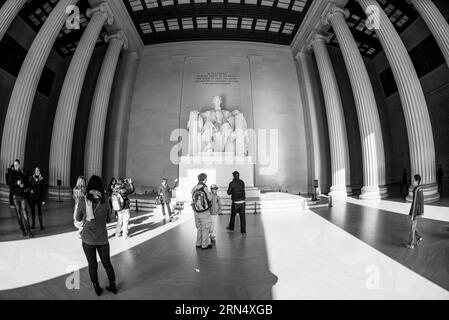 WASHINGTON DC, USA - Tourists visit the statue of Abraham Lincoln at the Lincoln Memorial in Washington DC. Wide-angle fisheye lens. Stock Photo