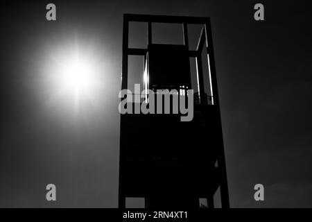 Netherlands Carillon, Arlington, Virginia — Black and White Photo | Netherlands Carillon, Arlington. Black and white photograph showing the tower silhouetted against a bright sun. Stock Photo