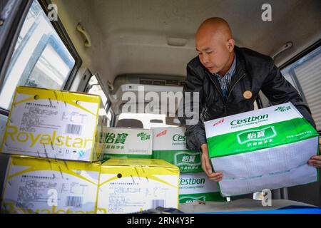 (150604) -- JIANLI, June 4, 2015 -- Resident Xiao Jianmin transports goods to a rescue base in Jianli, central China s Hubei Province, June 4, 2015. Xiao, 45, is the owner of an optical shop in Jianli. He volunteered to join in the rescue effort by offering rescuers and relatives of victims 400 boxes of bottled water and 60 boxes of instant noodles for free. A cruise ship carrying more than 450 people on Monday sank in the Jianli section of the Yangtze River. ) (wyo) CHINA-HUBEI-JIANLI-SHIP SINKING-RESCUE (CN) LixXiang PUBLICATIONxNOTxINxCHN   Jianli June 4 2015 Resident Xiao Jianmin Transport Stock Photo
