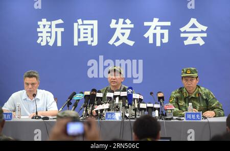 Liu Xiaowu (C), chief of staff of the Guangzhou Military Area Command, introduces rescue work at a press conference in Jianli County, central China s Hubei Province, June 6, 2015. The death toll from a Chinese cruise ship that capsized on the Yangtze River during freak weather has climbed to 396 as of Saturday noon. Only 14 people have been found alive so far, while another 46 people remain missing, according to the rescue headquarters in Jianli. The Eastern Star was carrying 456 people on a 11-day trip along the river when it was capsized by a tornado on Monday night. ) (lfj) CHINA-HUBEI-SINK Stock Photo