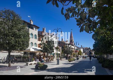 Pedestrian zone with restaurants in the old town of Grado, Friuli Venezia Giulia, Italy Stock Photo