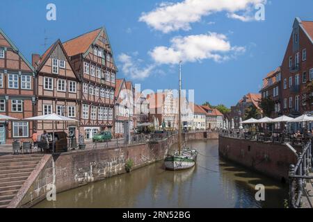 Historic merchant and warehouse houses at the Hanseatic harbour with the sailing ship Willi, Old Town, Stade, Lower Saxony, Germany Stock Photo