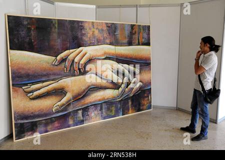 (150610) -- DAMASCUS, June 10, 2015 -- A visitor attends an art fair with the theme featuring sacrifices of the Syrian army at the Fine Art Faculty in Damascus, the capital of Syria, on June 10, 2015. ) SYRIA-DAMASCUS-ART FAIR Ammar PUBLICATIONxNOTxINxCHN   Damascus June 10 2015 a Visitor Attends to Art Fair With The Theme featuring sacrifices of The Syrian Army AT The Fine Art faculty in Damascus The Capital of Syria ON June 10 2015 Syria Damascus Art Fair Ammar PUBLICATIONxNOTxINxCHN Stock Photo