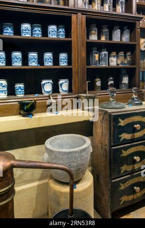 Antique pharmacy cabinet with vintage jars at the Orval Abbey / Abbaye Notre-Dame d'Orval, Villers-devant-Orval, Florenville, Wallonia, Belgium Stock Photo