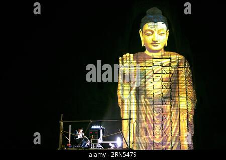 150612 -- KABUL, June 12, 2015 -- Photo taken on June 7, 2015 shows the projection of the Bamyan Buddha in Bamyan province, central Afghanistan. A Chinese couple, and Liang Hong, successfully projected the image of the tallest Buddha in Bamyan Valley on June 6 and 7, using the latest cultural relics-friendly technology, eliciting cheers from the local people. The two Bamyan Buddhas were bombed and smashed to the ground by Taliban in 2001 despite appeals from the international community.  AFGHANISTAN-BAMYAN-BAMYAN BUDDHA-IMAGE PROJECTION ZhangxXinyu PUBLICATIONxNOTxINxCHN Stock Photo