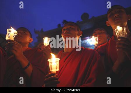 (150613) -- KATHMANDU, June 12, 2015 -- Nepalese Buddhist monks participate in a candle light vigil and offer prayers to memorize earthquake victims at Bouddhanath Stupa in Kathmandu, Nepal, on June 12, 2015. )(zhf) NEPAL-KATHMANDU-EARTHQUAKE-PRAYERS PratapxThapa PUBLICATIONxNOTxINxCHN   Kathmandu June 12 2015 Nepalese Buddhist Monks participate in a Candle Light Vigil and OFFER Prayers to memorize Earthquake Victims AT Bouddhanath Stupa in Kathmandu Nepal ON June 12 2015 zhf Nepal Kathmandu Earthquake Prayers PratapxThapa PUBLICATIONxNOTxINxCHN Stock Photo