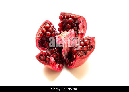Section of pomegranate isolated on white background Stock Photo