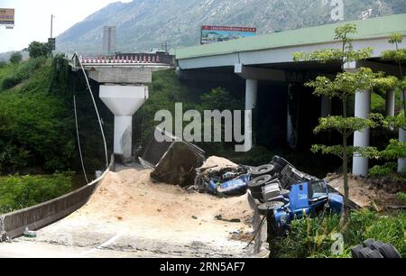 REFILED WITH A NEW PICTURE. (150619) -- HEYUAN, June 19, 2015 -- Heavy trucks fall under a highway after a ramp of the Guangdong-Jiangxi Highway collapses in Heyuan, south China s Guangdong Province, June 19, 2015. The accident, which killed one person and injured four others, happened at 3:40 a.m. on June 19 (1940 GMT on June 18) in Heyuan City when a bridge ruptured with four heavy trucks loaded with porcelain clay on it, according to an investigation. The highway, opened to traffic in December of 2005, connects Guangdong with east China s Jiangxi Province. ) (lfj) (REFILING)CHINA-GUANGDONG- Stock Photo