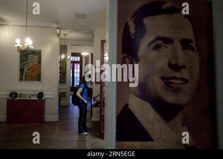 File photo taken on May 18, 2011 shows a visitor watching the objects displayed at Casa Gardel House Museum in Buenos Aires, Argentina. People commemorate the 80th death anniversary of Carlos Gardel on Wednesday. Carlos Gardel was a singer, songwriter, composer and actor, and the most prominent tango figure in the first half of 20th century. For many, Gardel embodies the soul of tango style. Gardel died in an airplane crash at the height of his carrer, becoming an archetypal tragic hero mounrned throughout Latin America. )(zhf) ARGENTINA-BUENOS AIRES-MUSIC-GARDEL-ANNIVERSARY MartinxZabala PUBL Stock Photo