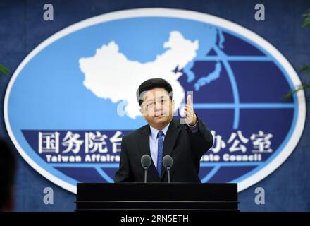 (150624) -- BEIJING, June 24, 2015 -- Ma Xiaoguang, spokesman for the State Council Taiwan Affairs Office, gestures at a press conference in Beijing, capital of China, June 24, 2015. The Chinese mainland welcomes people from all walks of life in Taiwan, including veterans who fought the war and their relatives, to attend the mainland s commemoration of the 70th anniversary of the end of World War II. Ma Xiaoguang, spokesman for the State Council Taiwan Affairs Office, told the press conference that the victory in the Chinese People s War of Resistance against Japanese Aggression was owned by t Stock Photo