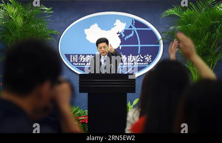 (150624) -- BEIJING, June 24, 2015 -- Ma Xiaoguang, spokesman for the State Council Taiwan Affairs Office, gestures at a press conference in Beijing, capital of China, June 24, 2015. The Chinese mainland welcomes people from all walks of life in Taiwan, including veterans who fought the war and their relatives, to attend the mainland s commemoration of the 70th anniversary of the end of World War II. Ma Xiaoguang, spokesman for the State Council Taiwan Affairs Office, told the press conference that the victory in the Chinese People s War of Resistance against Japanese Aggression was owned by t Stock Photo