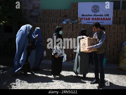 (150625) -- KABUL, June 25, 2015 -- Afghan women receive food donated by Muslim Hands International organization for poor people during the holy month of Ramadan in Kabul, Afghanistan, June 25, 2015. ) AFGHANISTAN-KABUL-RAMADAN-FOOD-DISTRIBUTION AhmadxMassoud PUBLICATIONxNOTxINxCHN   150625 Kabul June 25 2015 Afghan Women receive Food Donated by Muslim Hands International Organization for Poor Celebrities during The Holy Month of Ramadan in Kabul Afghanistan June 25 2015 Afghanistan Kabul Ramadan Food Distribution AhmadxMassoud PUBLICATIONxNOTxINxCHN Stock Photo