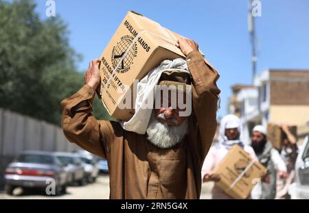 (150625) -- KABUL, June 25, 2015 -- An Afghan man carries food donated by Muslim Hands International organization for poor people during the holy month of Ramadan in Kabul, Afghanistan, June 25, 2015.) AFGHANISTAN-KABUL-RAMADAN-FOOD-DISTRIBUTION AhmadxMassoud PUBLICATIONxNOTxINxCHN   150625 Kabul June 25 2015 to Afghan Man carries Food Donated by Muslim Hands International Organization for Poor Celebrities during The Holy Month of Ramadan in Kabul Afghanistan June 25 2015 Afghanistan Kabul Ramadan Food Distribution AhmadxMassoud PUBLICATIONxNOTxINxCHN Stock Photo