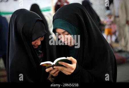 (150625) -- KABUL, June 25, 2015 -- Afghan girls read a book on a religious book exhibition during the holy month of Ramadan in Kabul, Afghanistan, June 25, 2015. ) AFGHANISTAN-KABUL-BOOK-EXHIBITION AhmadxMassoud PUBLICATIONxNOTxINxCHN   150625 Kabul June 25 2015 Afghan Girls Read a Book ON a Religious Book Exhibition during The Holy Month of Ramadan in Kabul Afghanistan June 25 2015 Afghanistan Kabul Book Exhibition AhmadxMassoud PUBLICATIONxNOTxINxCHN Stock Photo