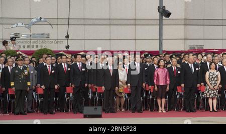 (150701) -- HONG KONG, July 1, 2015 -- Tung Chee-hwa (4th L Front), vice chairman of the National Committee of the Chinese People s Political Consultative Conference, Hong Kong Special Administrative Region Chief Executive Leung Chun-ying (4th R Front) and head of the Liaison Office of the Central People s Government in Hong Kong Zhang Xiaoming (3rd L Front) attend the raising ceremony of the Chinese national flag and the flag of Hong Kong Special Administrative Regoin at the Golden Bauhinia Square in Hong Kong, south China, July 1, 2015 in celebration of the 18th anniversary of Hong Kong s re Stock Photo