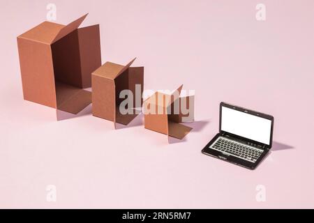 High angle boxes laptop arrangement Stock Photo