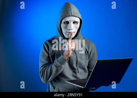 portrait of hacker with mask and binary code background Stock Photo - Alamy