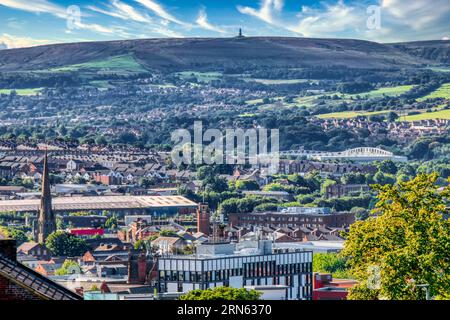 Blackburn Town with Darwen Moors in the distance Stock Photo