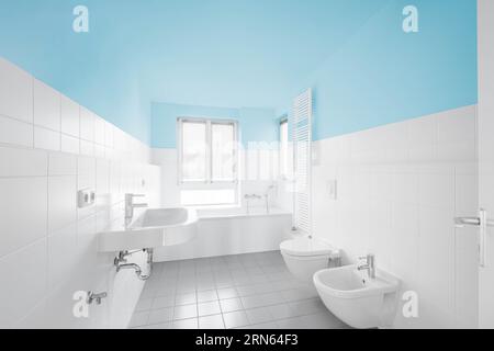 blue, white bathroom - modern tiled bath bathtub Stock Photo