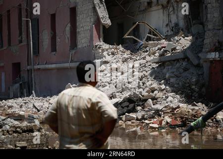 (150711) -- CAIRO, July 11, 2015 -- An investigator stands at the explosion site outside Italian Consulate in downtown Cairo, capital of Egypt, on July 11, 2015. A powerful explosion occurred in front of Italian Consulate in downtown Cairo Saturday, killing one person and injuring seven, according to Egypt s Health Ministry. ) EGYPT-CAIRO-ITALIAN CONSULATE-EXPLOSION CuixXinyu PUBLICATIONxNOTxINxCHN   150 711 Cairo July 11 2015 to Investigator stands AT The Explosion Site outside Italian consulate in Downtown Cairo Capital of Egypt ON July 11 2015 a Powerful Explosion occurred in Front of Itali Stock Photo