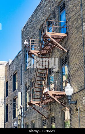 Fire escape in the historic Exchange District on a typical brick facade from around 1915, Winnipeg, province of Manitoba, Canada Stock Photo