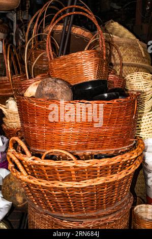 A pile of handmade picnic baskets made from plant fibers Stock Photo