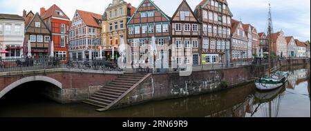 Panoramic photo Medieval Historic Merchant and Warehouse Houses at the Hanseatic Harbour with the Sailing Ship Willi, Old Town, Stade, Lower Saxony Stock Photo