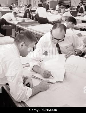 1960s TWO MEN ENGINEERS GOING OVER SPECIFICATIONS AT DRAFTING TABLE - d5585 HAR001 HARS LIFESTYLE JOBS MANAGER COPY SPACE HALF-LENGTH PERSONS MALES PLANNING PROFESSION CONFIDENCE EXECUTIVES B&W GOALS SUCCESS SKILL OCCUPATION SKILLS HEAD AND SHOULDERS HIGH ANGLE CONSULTING STRATEGY CAREERS CHOICE KNOWLEDGE PROGRESS PRIDE AUTHORITY OCCUPATIONS BOSSES CONCEPTUAL DRAFTING ENGINEERS SUPPORT COOPERATION MANAGERS MID-ADULT MID-ADULT MAN PRECISION SOLUTIONS SPECIFICATIONS BLACK AND WHITE CAUCASIAN ETHNICITY HAR001 OLD FASHIONED Stock Photo