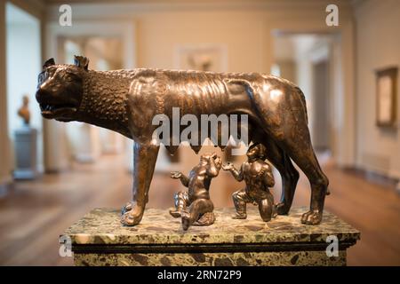 WASHINGTON DC, United States — A bronze sculpture of The She-Wolf Suckling Romulus and Remus ('Capitoline Wolf Suckling Romulus and Remus'), crafted in central Italy and dated to the late 15th to early 16th century, on display at the National Gallery of Art. This work is based on the ancient Roman legend of the twins Romulus and Remus, founders of Rome, and showcases the artistry of the Italian Renaissance. The piece is believed to have been influenced by the famous Capitoline Wolf and was once part of the Museo di Capodimonte collection in Naples. Stock Photo