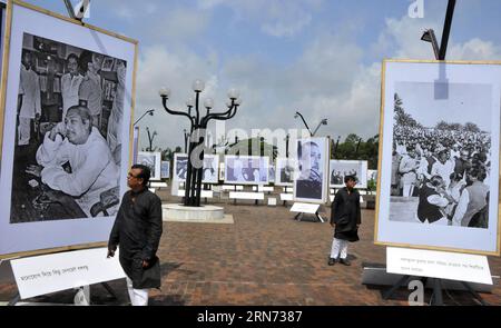 (150815) -- DHAKA, Aug. 15, 2015 -- Bangladeshi people visit a historical photograph exhibition on Bangladesh s founding father and first president Sheikh Mujibur Rahman in Dhaka, Bangladesh, Aug. 15, 2015. The nation commemorated on Friday the 40th death anniversary of Bangladesh s founding father and first president Sheikh Mujibur Rahman who was assassinated on Aug. 15, 1975. ) BANGLADESH-DHAKA-DEATH ANNIVERSARY-FIRST PRESIDENT SharifulxIslam PUBLICATIONxNOTxINxCHN   150815 Dhaka Aug 15 2015 Bangladeshi Celebrities Visit a Historical Photo Exhibition ON Bangladesh S Founding Father and First Stock Photo