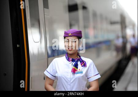 (150817) -- HARBIN, Aug. 17, 2015 -- The high-speed train D7989 prepares to depart for Qiqihar at the Harbin Railway Station in Harbin, capital of northeast China s Heilongjiang Province, Aug. 17, 2015. China s northernmost high-speed railway between two cities of Harbin and Qiqihar in Heilongjiang started operation on Monday. With a designated speed of 250 kilometers per hour and eight stops, the trip from Harbin to Qiqihar was reduced from three hours to 85 minutes. The trains have been modified to adapt to temperatures as low as minus 40 degrees Celsius and resist adverse weather, such as s Stock Photo