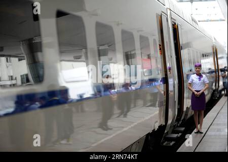 (150817) -- HARBIN, Aug. 17, 2015 -- The high-speed train D7989 prepares to depart for Qiqihar at the Harbin Railway Station in Harbin, capital of northeast China s Heilongjiang Province, Aug. 17, 2015. China s northernmost high-speed railway between two cities of Harbin and Qiqihar in Heilongjiang started operation on Monday. With a designated speed of 250 kilometers per hour and eight stops, the trip from Harbin to Qiqihar was reduced from three hours to 85 minutes. The trains have been modified to adapt to temperatures as low as minus 40 degrees Celsius and resist adverse weather, such as s Stock Photo