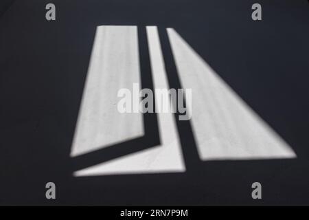 Black window shadows on the floor. Abstract blurry shadows of an open window. Stock Photo